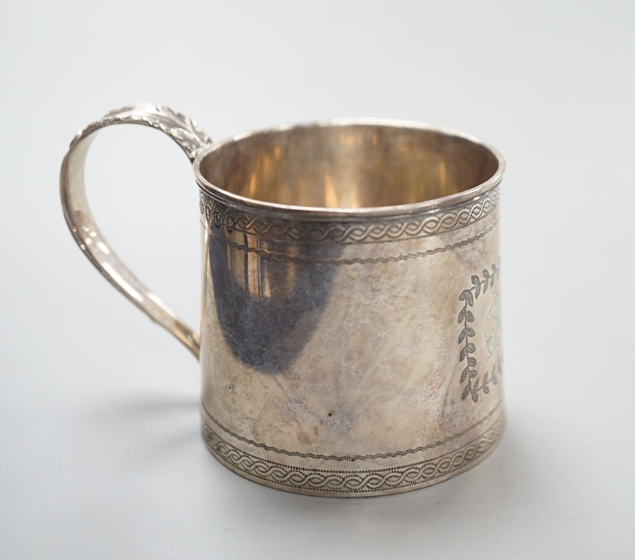 A George III silver small mug, Thomas Wallis & Jonthan Hayne, London, 1818, with engraved monogram, 57mm, 60 grams.